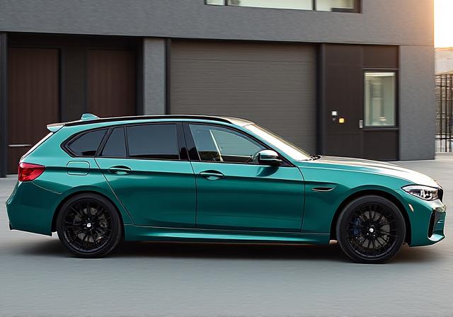 Dynamic side profile of a sleek BMW M3 Touring, parked elegantly outside the Caracal Motors workshop.